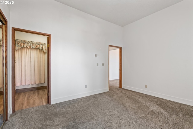 unfurnished room featuring carpet flooring