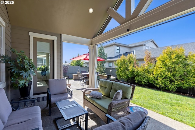 view of patio / terrace featuring outdoor dining area, fence, and an outdoor living space