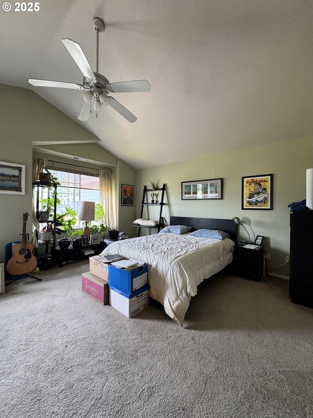 bedroom featuring carpet, lofted ceiling, a ceiling fan, and a textured ceiling