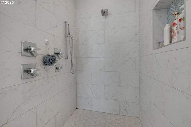 bathroom with a tile shower