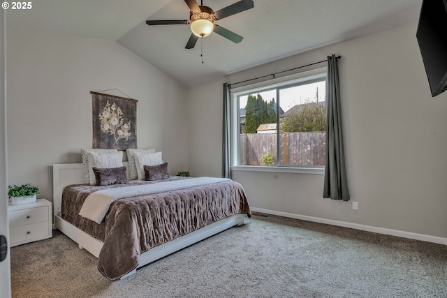 bedroom with ceiling fan, carpet floors, and vaulted ceiling