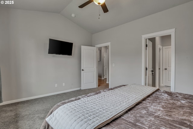 carpeted bedroom with vaulted ceiling and ceiling fan