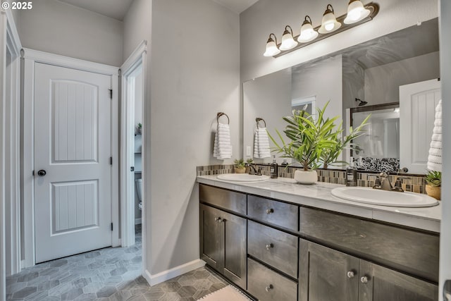 bathroom with vanity, toilet, and an enclosed shower