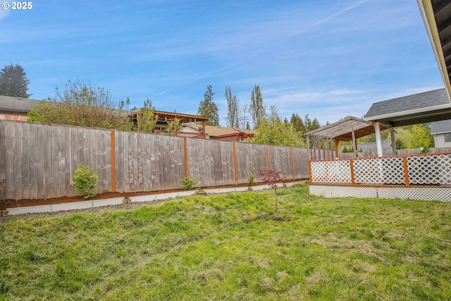 view of yard featuring a wooden deck