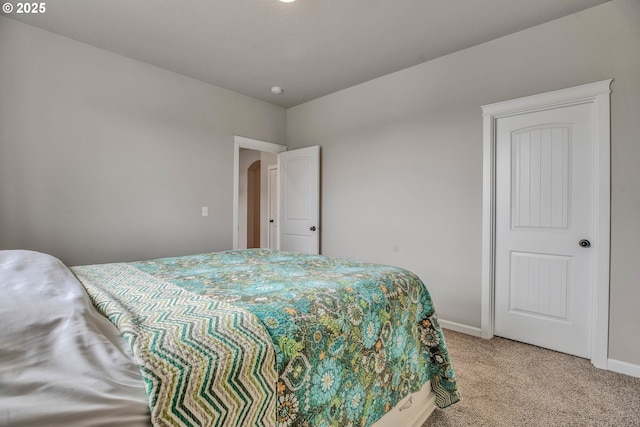 bedroom with light colored carpet