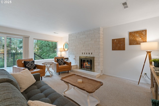 18308 NE Cole Witter Rd, Battle Ground, WA 98604 - living room featuring carpet floors, a stone fireplace, and baseboards