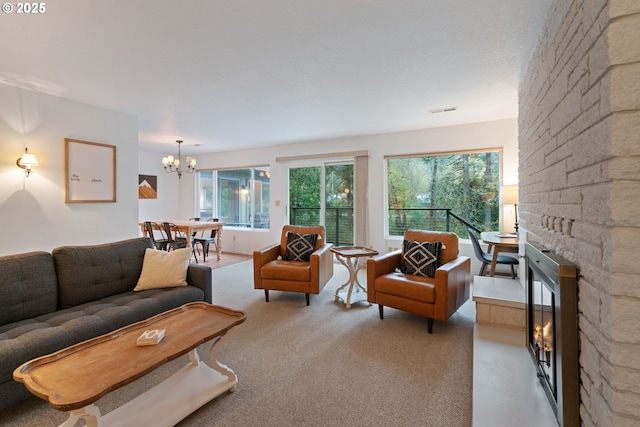 18308 NE Cole Witter Rd, Battle Ground, WA 98604 - living room featuring a stone fireplace and a chandelier
