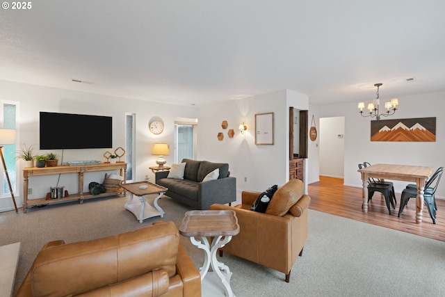 18308 NE Cole Witter Rd, Battle Ground, WA 98604 - living room featuring a chandelier, carpet flooring, and baseboards