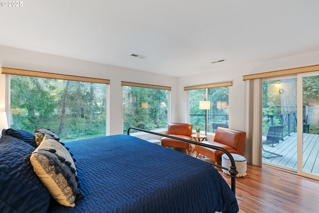18308 NE Cole Witter Rd, Battle Ground, WA 98604 - bedroom with access to outside and wood finished floors