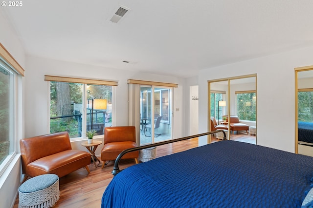 18308 NE Cole Witter Rd, Battle Ground, WA 98604 - bedroom with light wood-type flooring and access to exterior