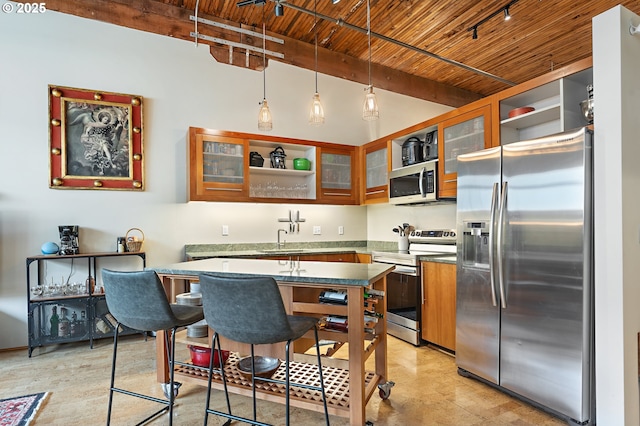 kitchen featuring beam ceiling, a sink, stainless steel appliances, glass insert cabinets, and wood ceiling