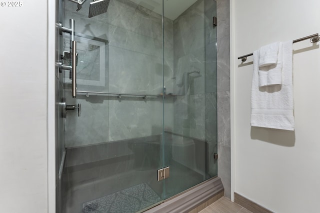 full bathroom featuring a stall shower