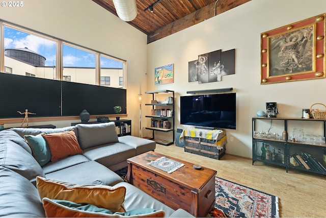 carpeted living room with wooden ceiling