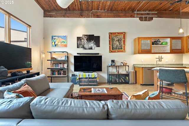 living room with beamed ceiling and wooden ceiling