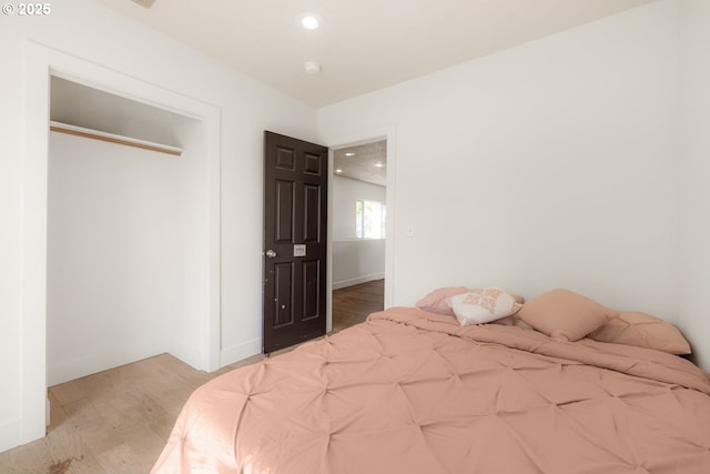 bedroom featuring recessed lighting and light wood-style floors