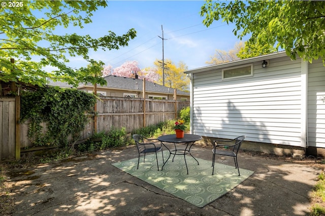 view of patio / terrace featuring fence
