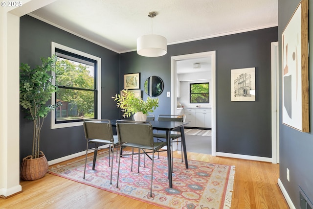 6833 NE 18th Ave, Portland, OR 97211 - dining space featuring wood finished floors, baseboards, and ornamental molding