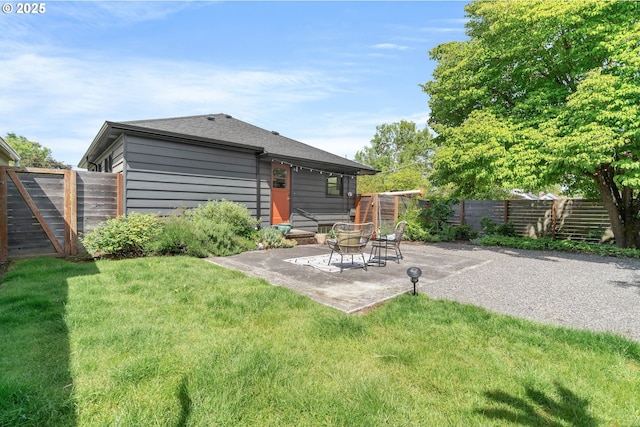 6833 NE 18th Ave, Portland, OR 97211 - rear view of property featuring a patio area and roof with shingles