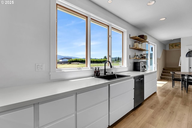 26815 NE Yacolt Rd, Yacolt, WA 98675 - kitchen featuring stainless steel dishwasher, a sink, recessed lighting, white cabinetry, and light wood-style flooring