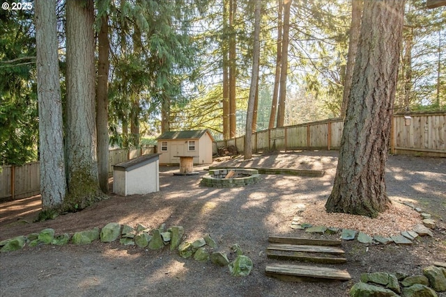 13135 SE Winston Rd, Damascus, OR 97089 - view of yard featuring an outdoor structure, a fenced backyard, and a storage unit