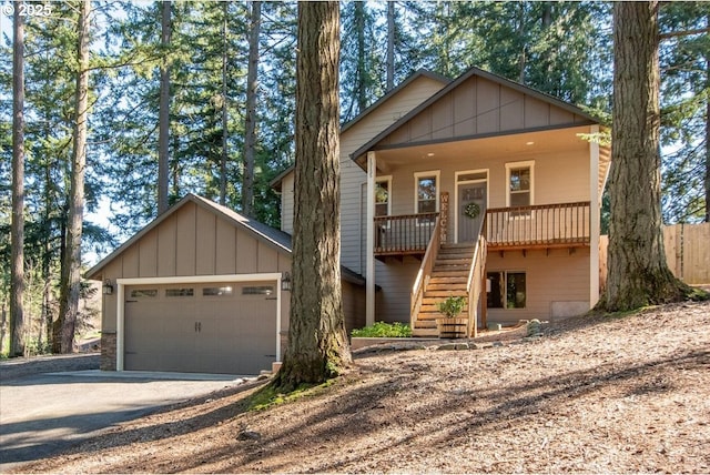 13135 SE Winston Rd, Damascus, OR 97089 - chalet / cabin with board and batten siding, stairway, driveway, and a porch