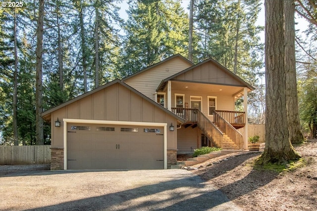 13135 SE Winston Rd, Damascus, OR 97089 - chalet / cabin featuring an attached garage, gravel driveway, stairs, and stone siding