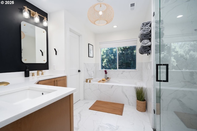 16223 SW 146th Ave, Portland, OR 97224 - bathroom with a bath, double vanity, marble finish floors, a marble finish shower, and recessed lighting
