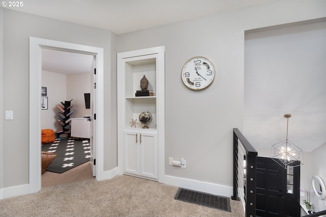 16223 SW 146th Ave, Portland, OR 97224 - hallway with carpet, a chandelier, and baseboards