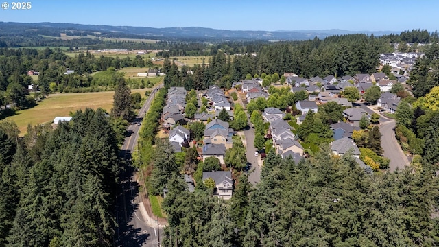 16223 SW 146th Ave, Portland, OR 97224 - aerial overview of property's location featuring a forest, nearby suburban area, and a mountainous background