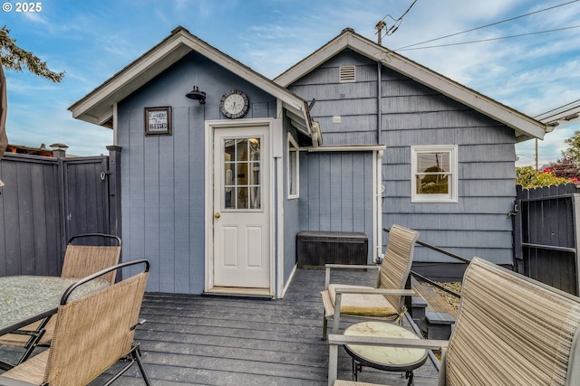 3175 Sherman Ave, North Bend, OR 97459 - back of property with fence and a wooden deck