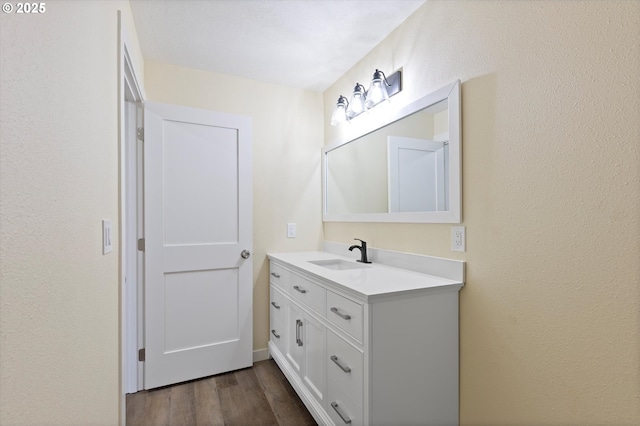 412 Monmouth Ave S, Monmouth, OR 97361 - bathroom with wood finished floors and vanity