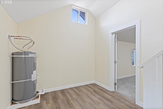 412 Monmouth Ave S, Monmouth, OR 97361 - interior space featuring lofted ceiling, strapped water heater, light wood-style flooring, and baseboards