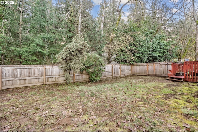 view of yard with a wooden deck