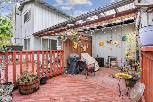 wooden deck featuring a pergola