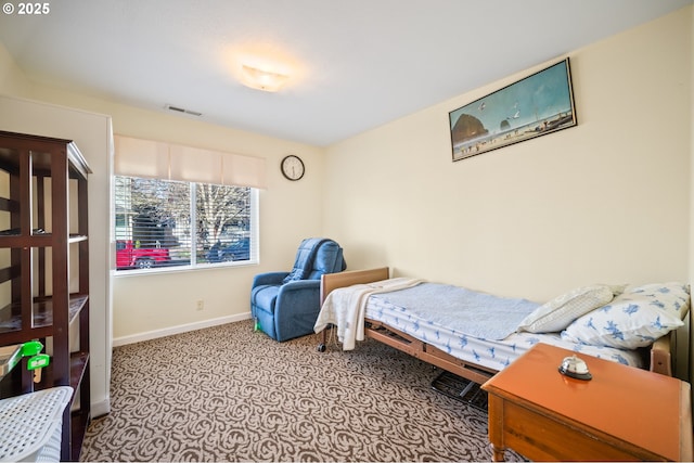 bedroom featuring visible vents and baseboards