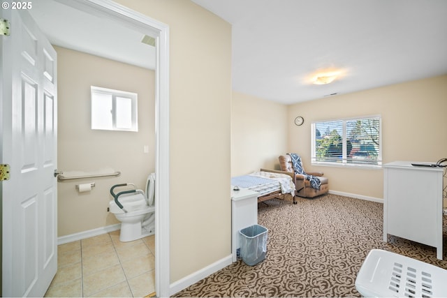tiled bedroom with visible vents and baseboards