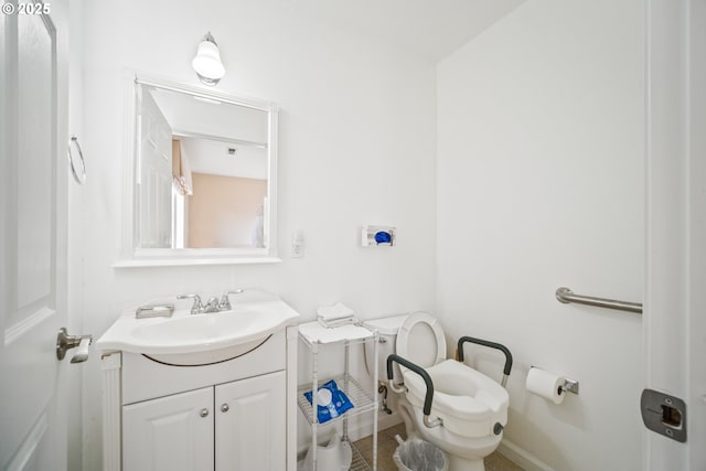 bathroom with tile patterned flooring, toilet, and vanity