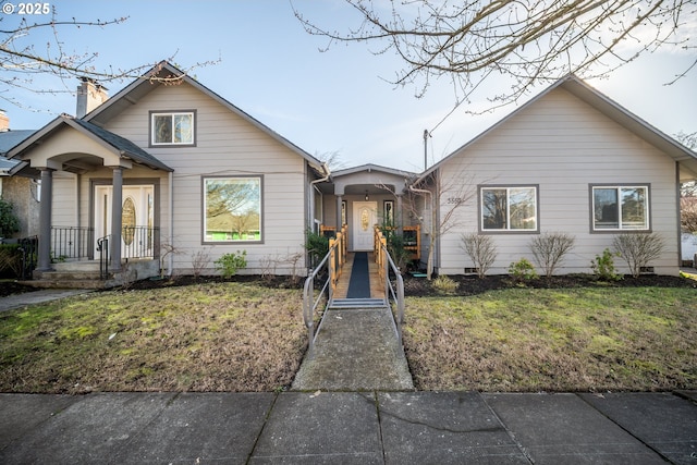 bungalow with a front lawn