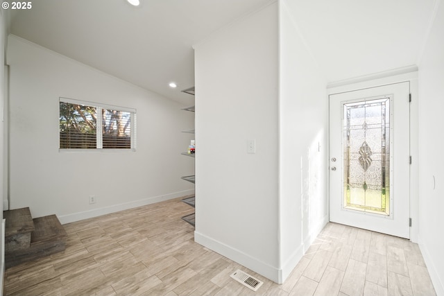 entryway featuring baseboards, visible vents, light wood-style flooring, recessed lighting, and vaulted ceiling