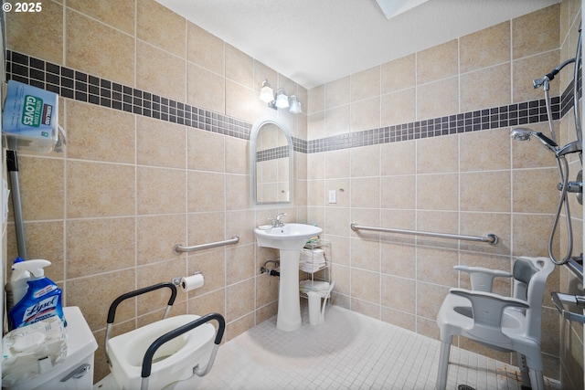 bathroom with walk in shower and tile walls