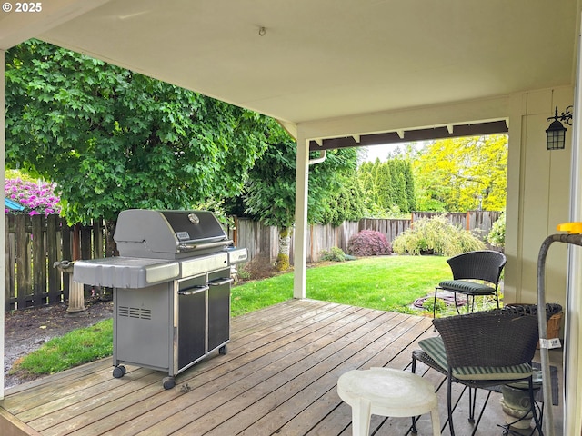 wooden terrace featuring grilling area