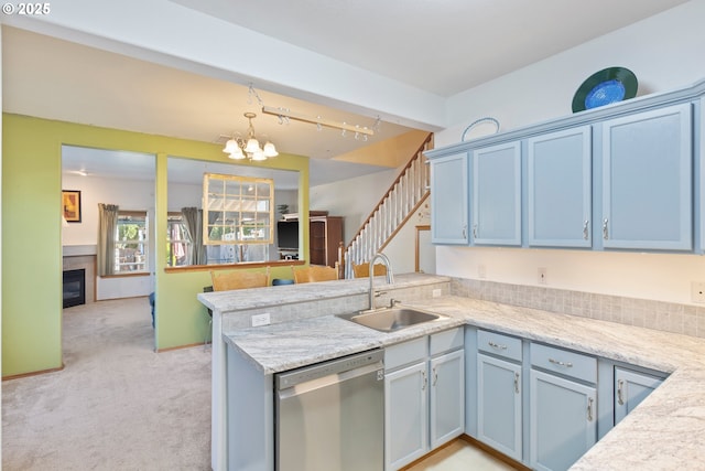 kitchen featuring sink, dishwasher, decorative light fixtures, light colored carpet, and kitchen peninsula