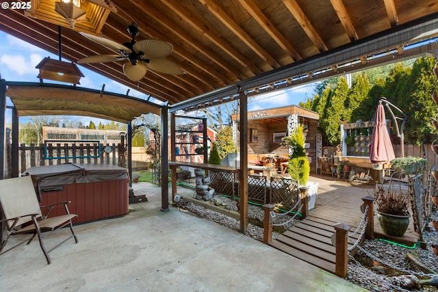 view of patio / terrace with a hot tub and ceiling fan