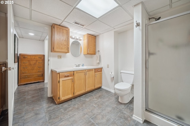 bathroom featuring visible vents, a stall shower, toilet, and vanity
