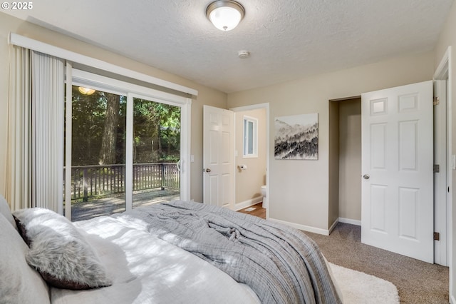 4718 SW Miles Ct, Portland, OR 97219 - bedroom with access to outside, carpet floors, a textured ceiling, and baseboards