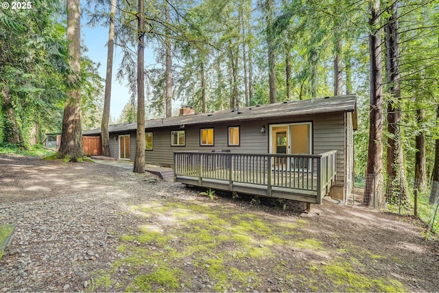 4718 SW Miles Ct, Portland, OR 97219 - rear view of house featuring a deck and a chimney