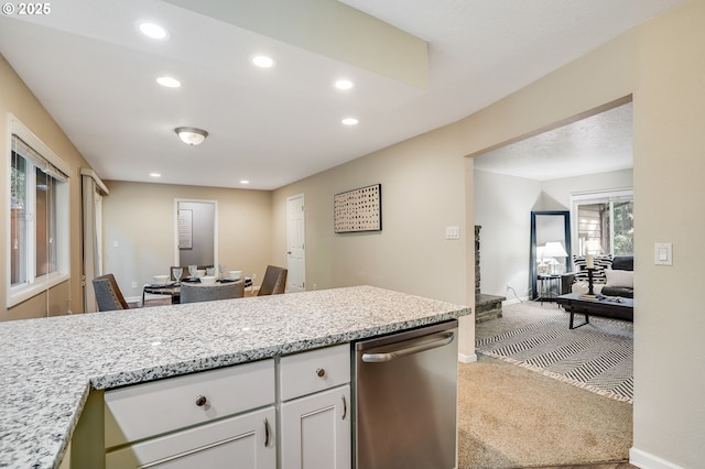 4718 SW Miles Ct, Portland, OR 97219 - kitchen with carpet floors, dishwasher, white cabinetry, recessed lighting, and a peninsula