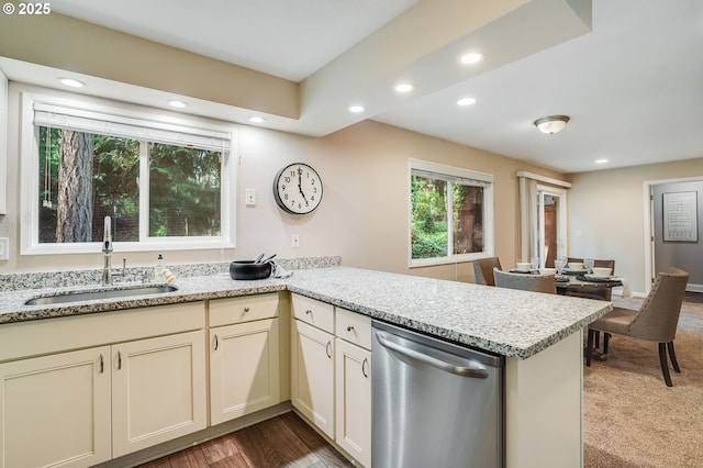 4718 SW Miles Ct, Portland, OR 97219 - kitchen with stainless steel dishwasher, a sink, a peninsula, recessed lighting, and light stone counters