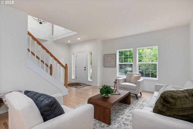 15530 SW Brighton Ct, Beaverton, OR 97007 - living area featuring stairway, wood finished floors, recessed lighting, and baseboards