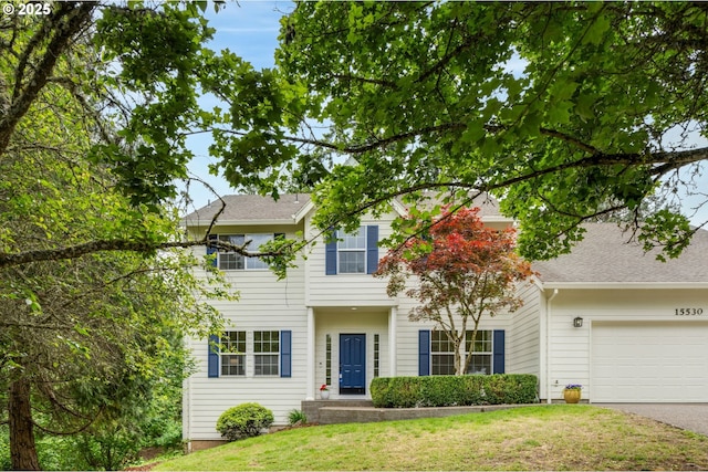 15530 SW Brighton Ct, Beaverton, OR 97007 - view of front facade with a front lawn, asphalt driveway, and an attached garage